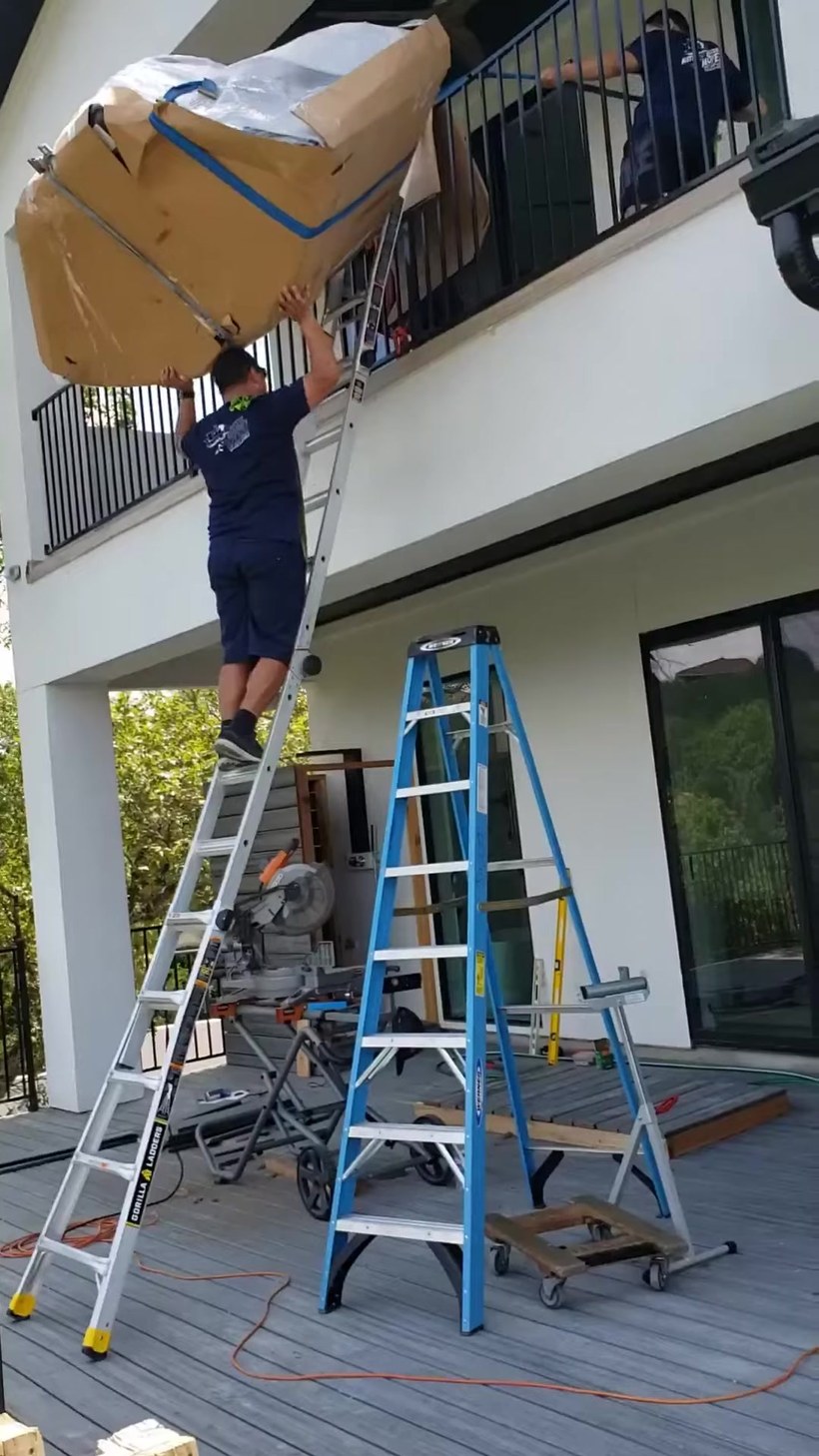 Everyday Movers crew handling a piece on a Worcester job